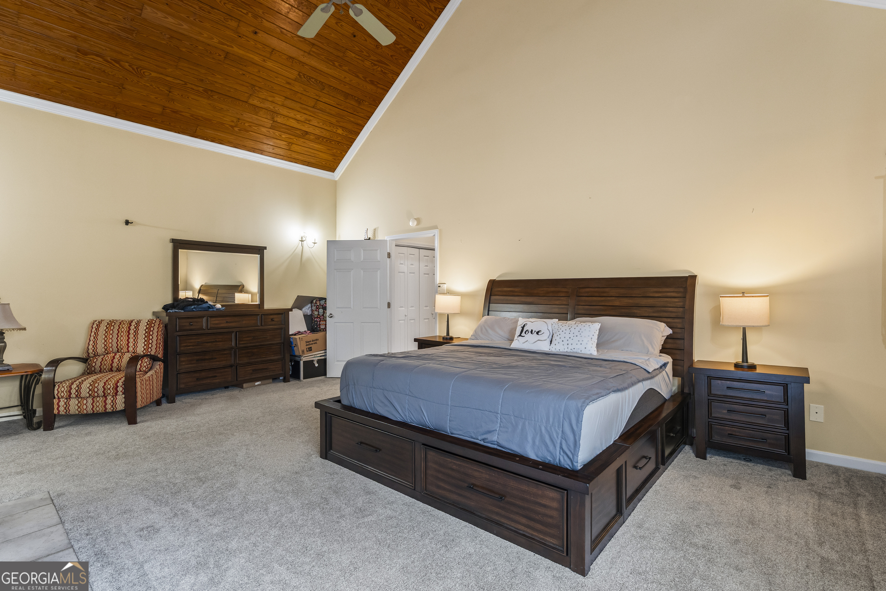 568 Hunt Road Carnesville, GA 30521 - Photo 50 of 106 a spacious bedroom with a bed and a chair