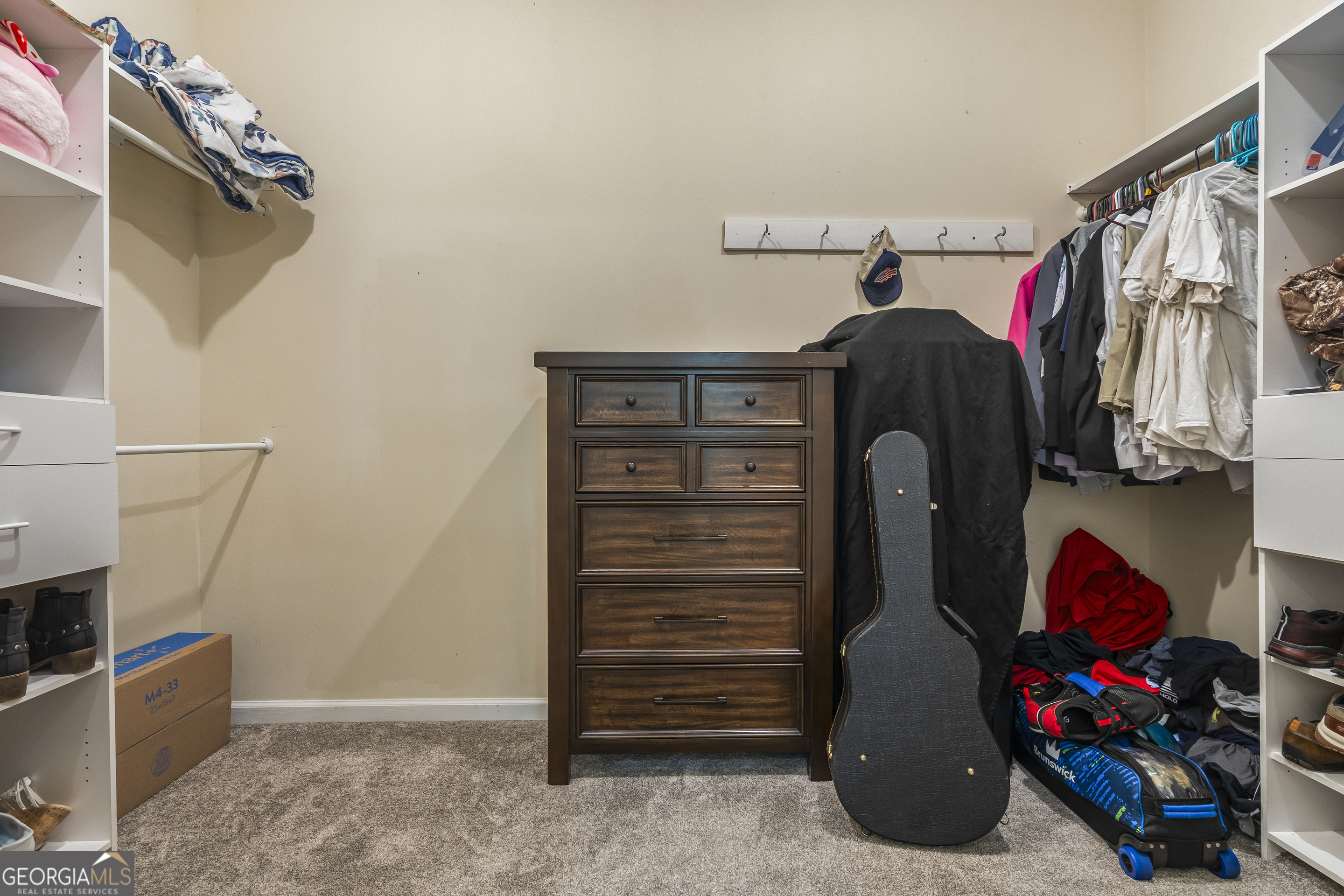 568 Hunt Road Carnesville, GA 30521 - Photo 59 of 106 a view of walk in closet with clothes and shoes
