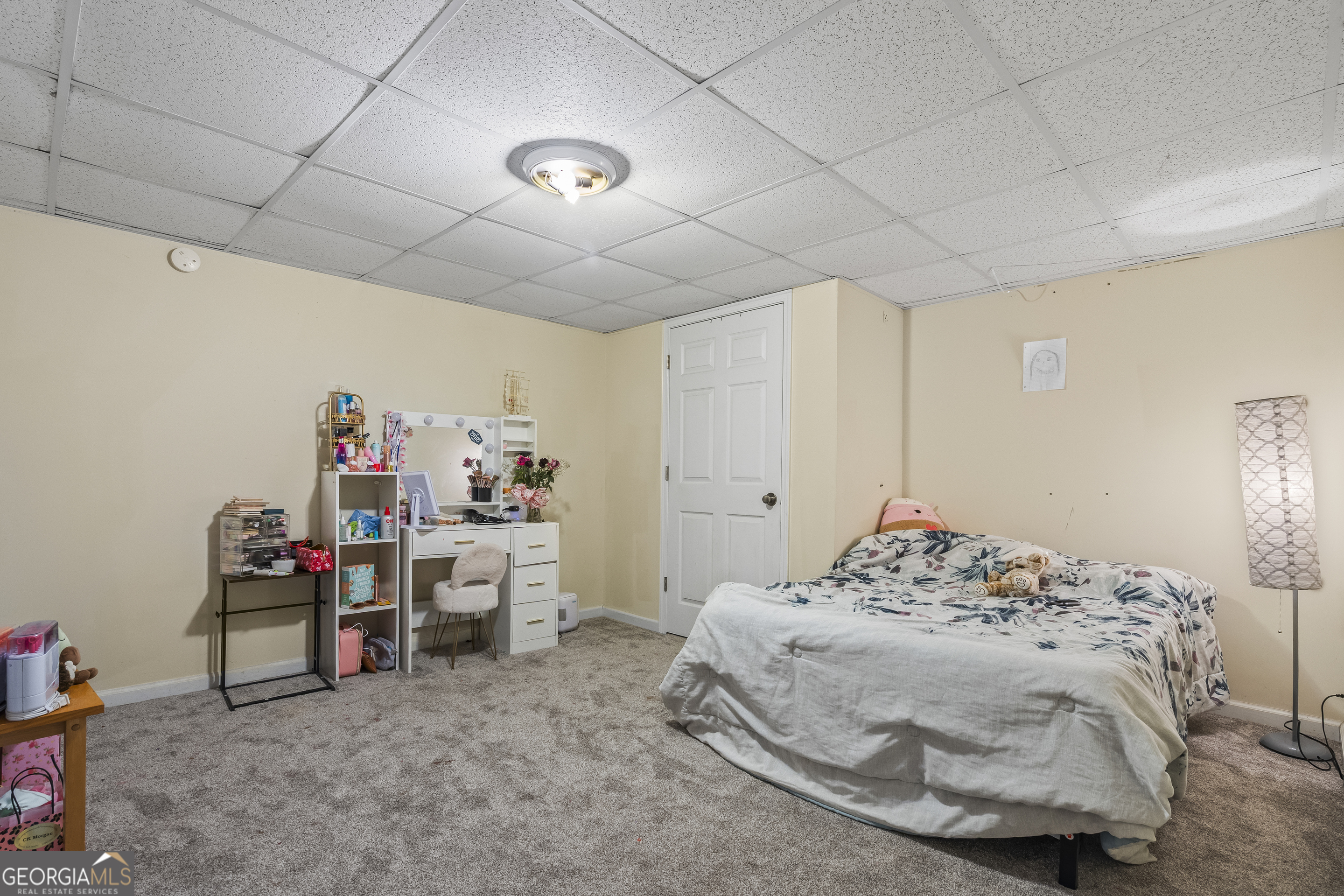 568 Hunt Road Carnesville, GA 30521 - Photo 68 of 106 a bedroom with a bed and a chandelier