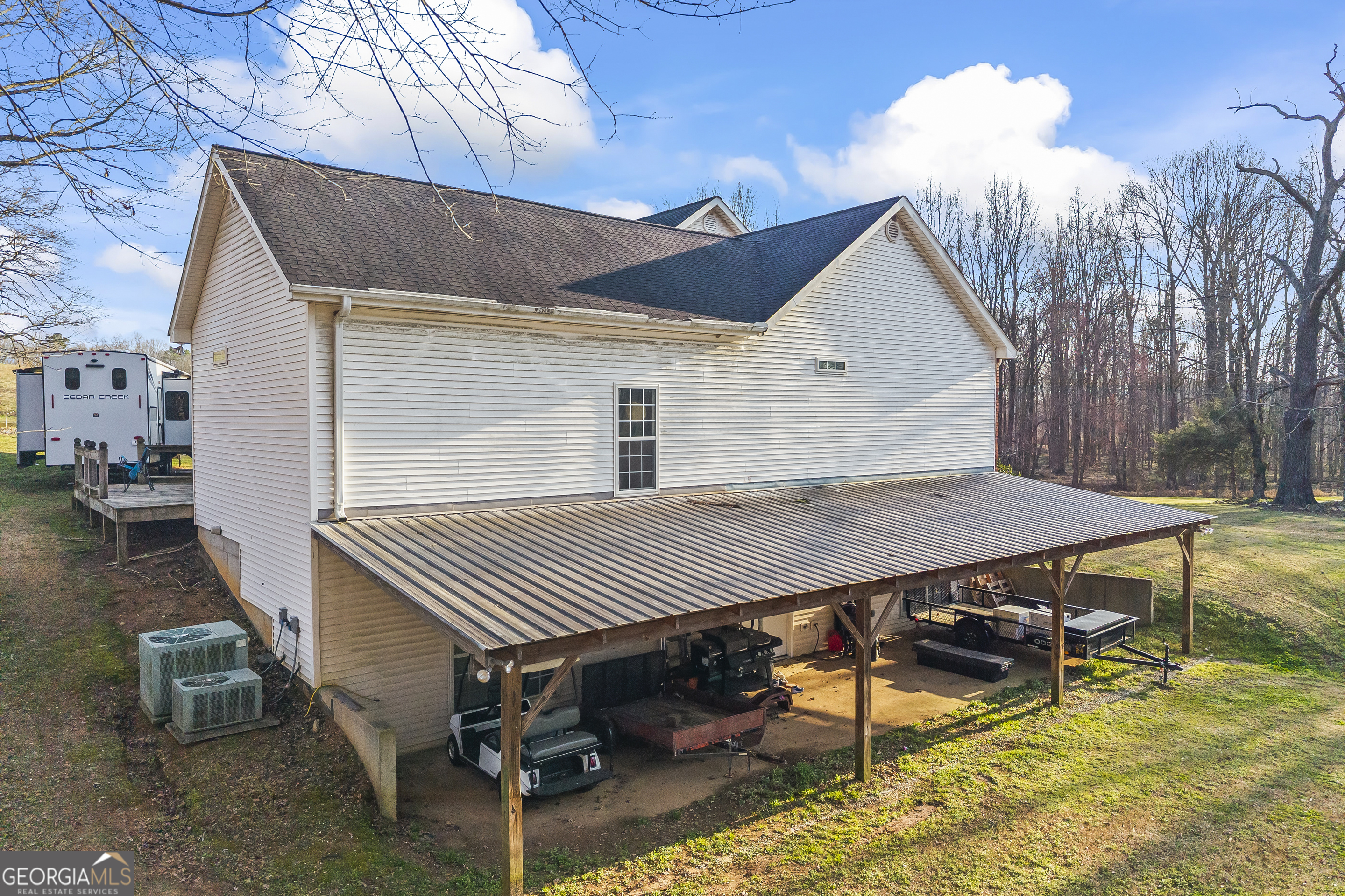 568 Hunt Road Carnesville, GA 30521 - Photo 7 of 106 a view of house with backyard space and sitting area