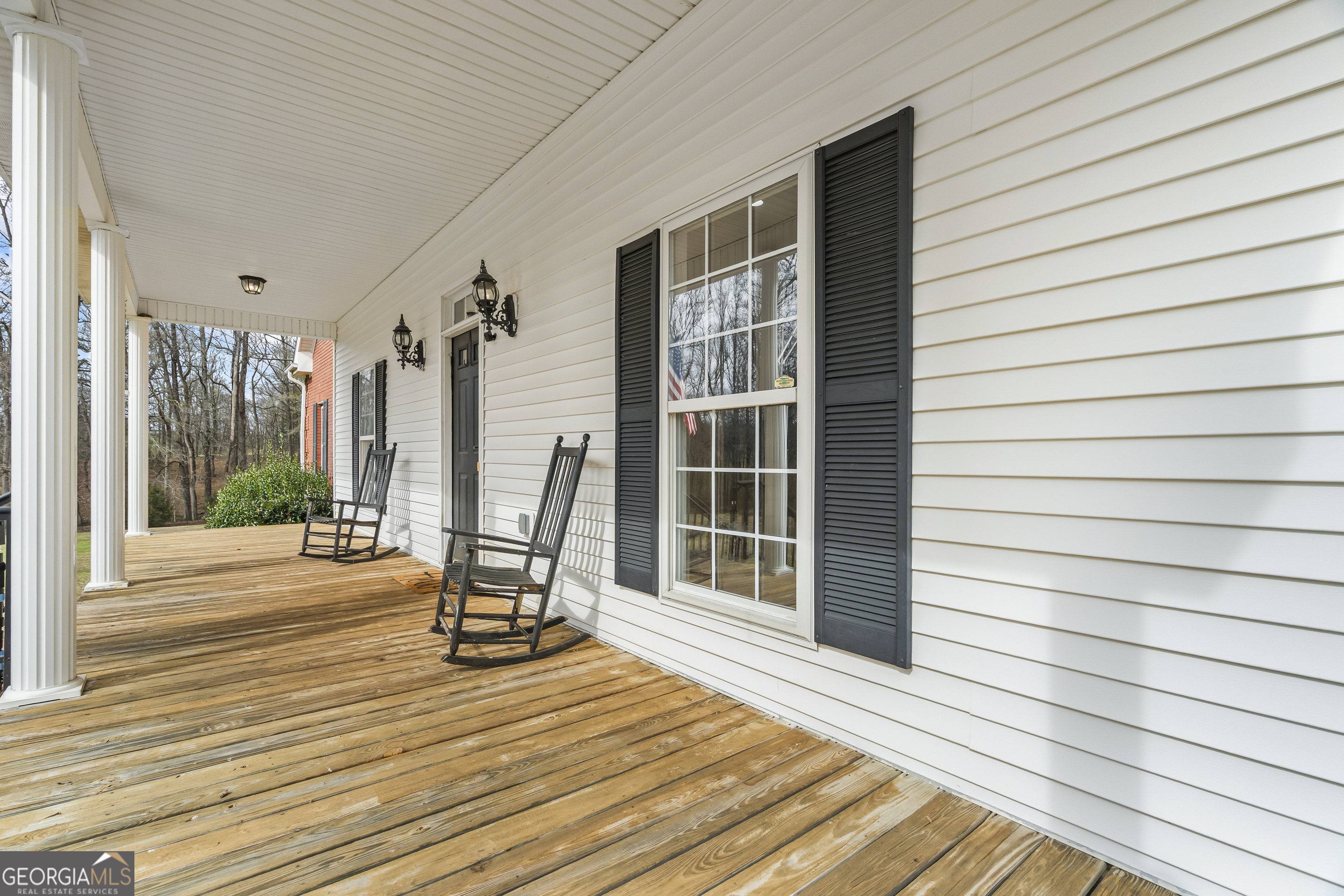 568 Hunt Road Carnesville, GA 30521 - Photo 8 of 106 a view of a house with wooden deck and furniture