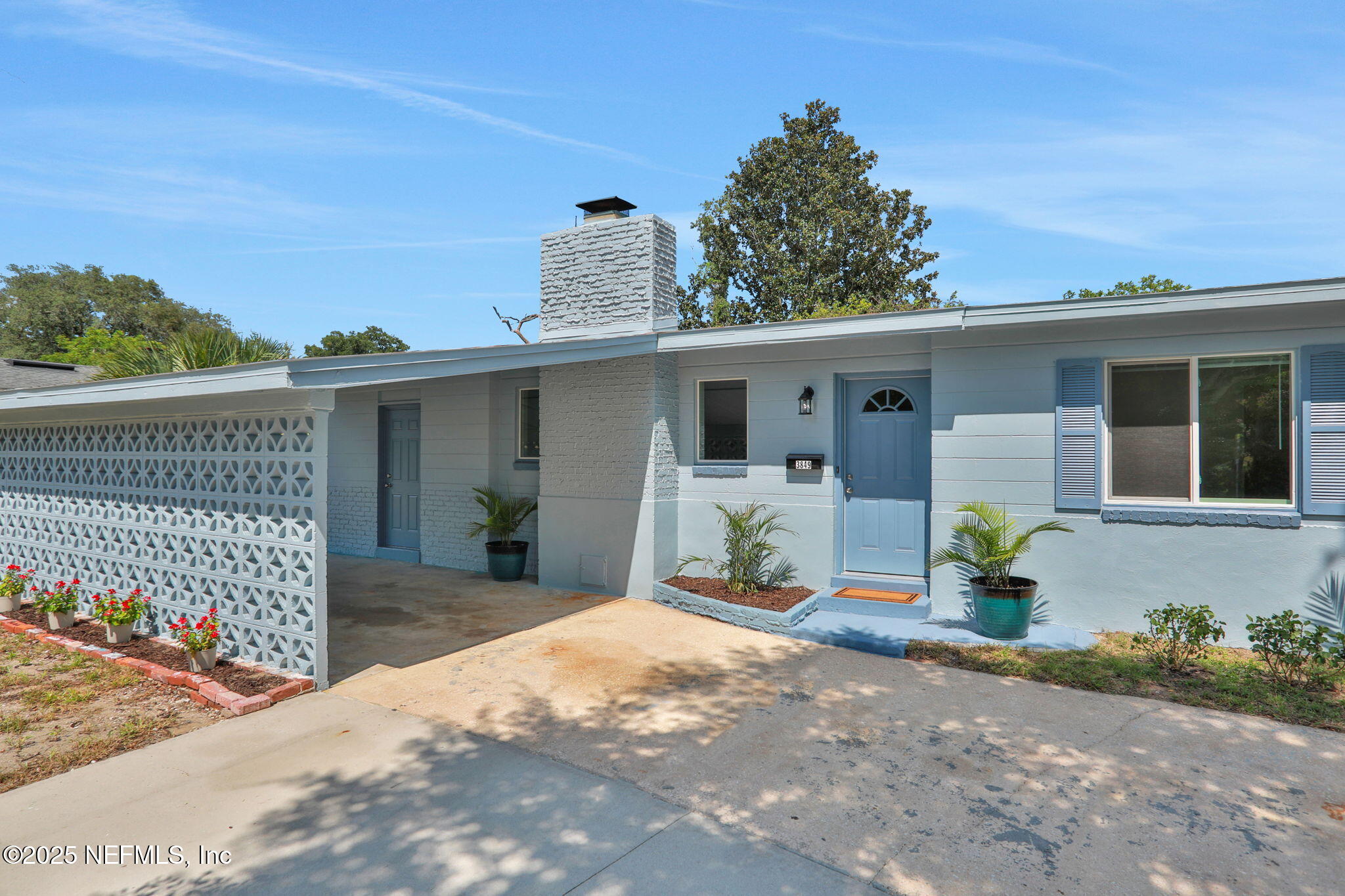 3849 Rogero Road Jacksonville, FL 32277 - Photo 3 of 47 a front view of a house with basket ball court