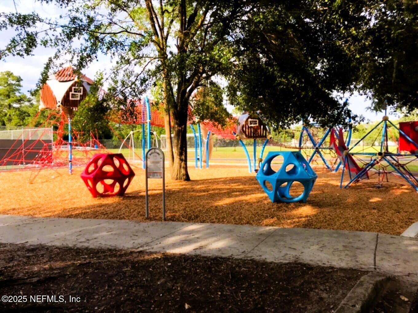 3849 Rogero Road Jacksonville, FL 32277 - Photo 33 of 47 a view of a park with large trees