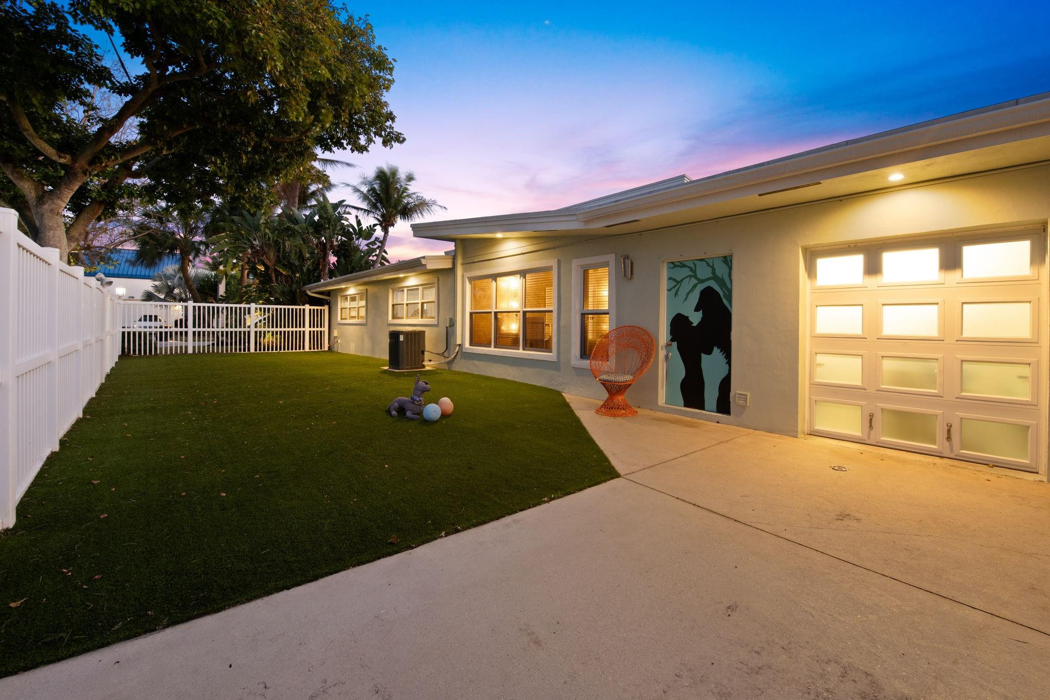 2675 Northeast 24th Street Lighthouse Point, FL 33064 - Photo 13 of 48 a view of a house with a backyard