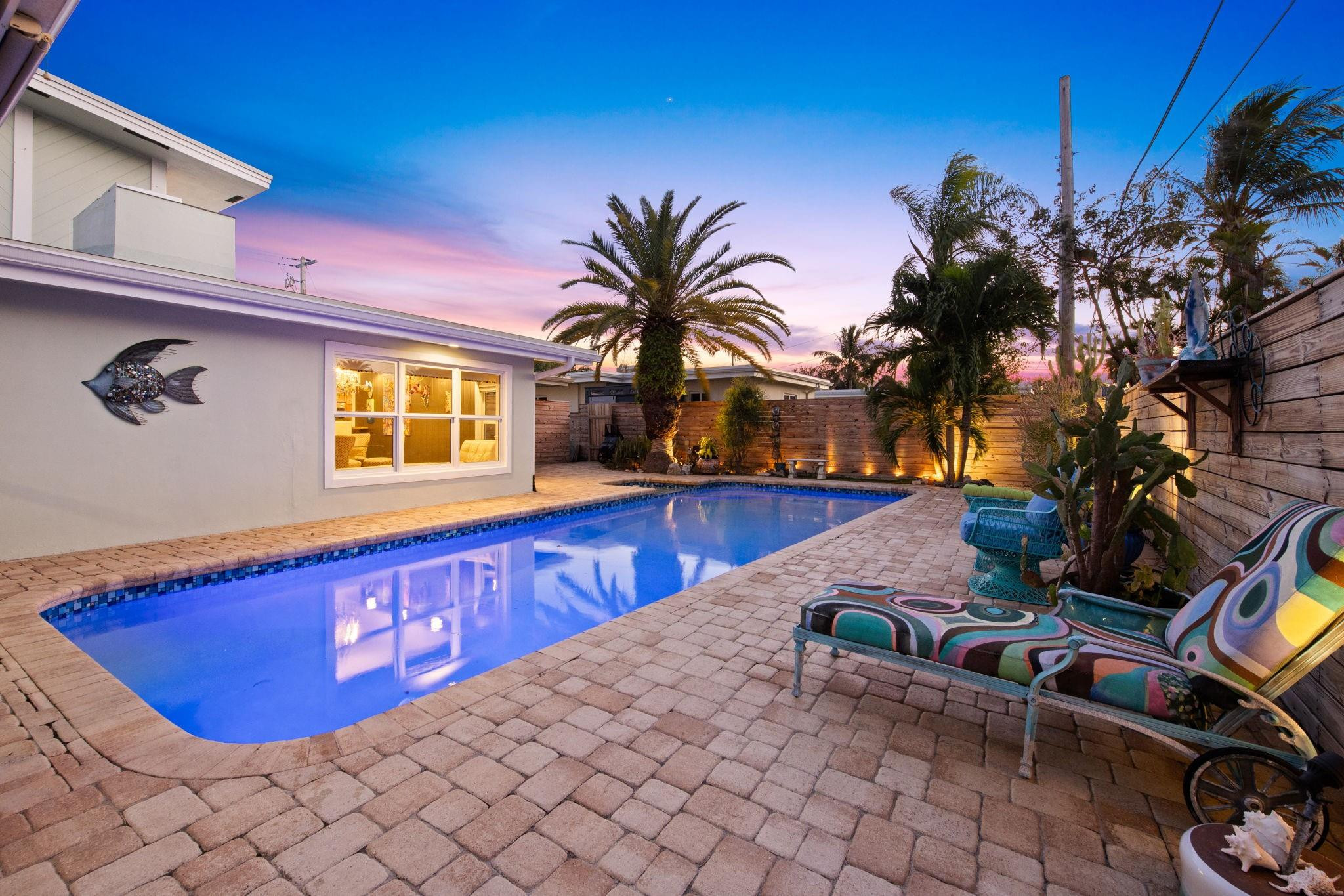2675 Northeast 24th Street Lighthouse Point, FL 33064 - Photo 14 of 48 a view of a backyard with plants
