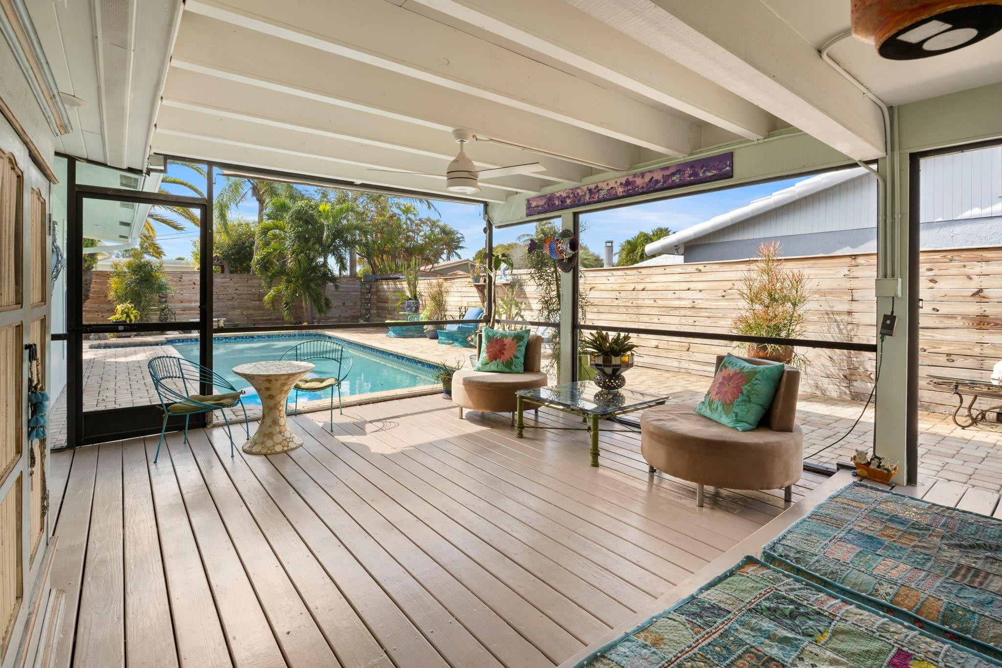 2675 Northeast 24th Street Lighthouse Point, FL 33064 - Photo 26 of 48 an outdoor living room with a large window