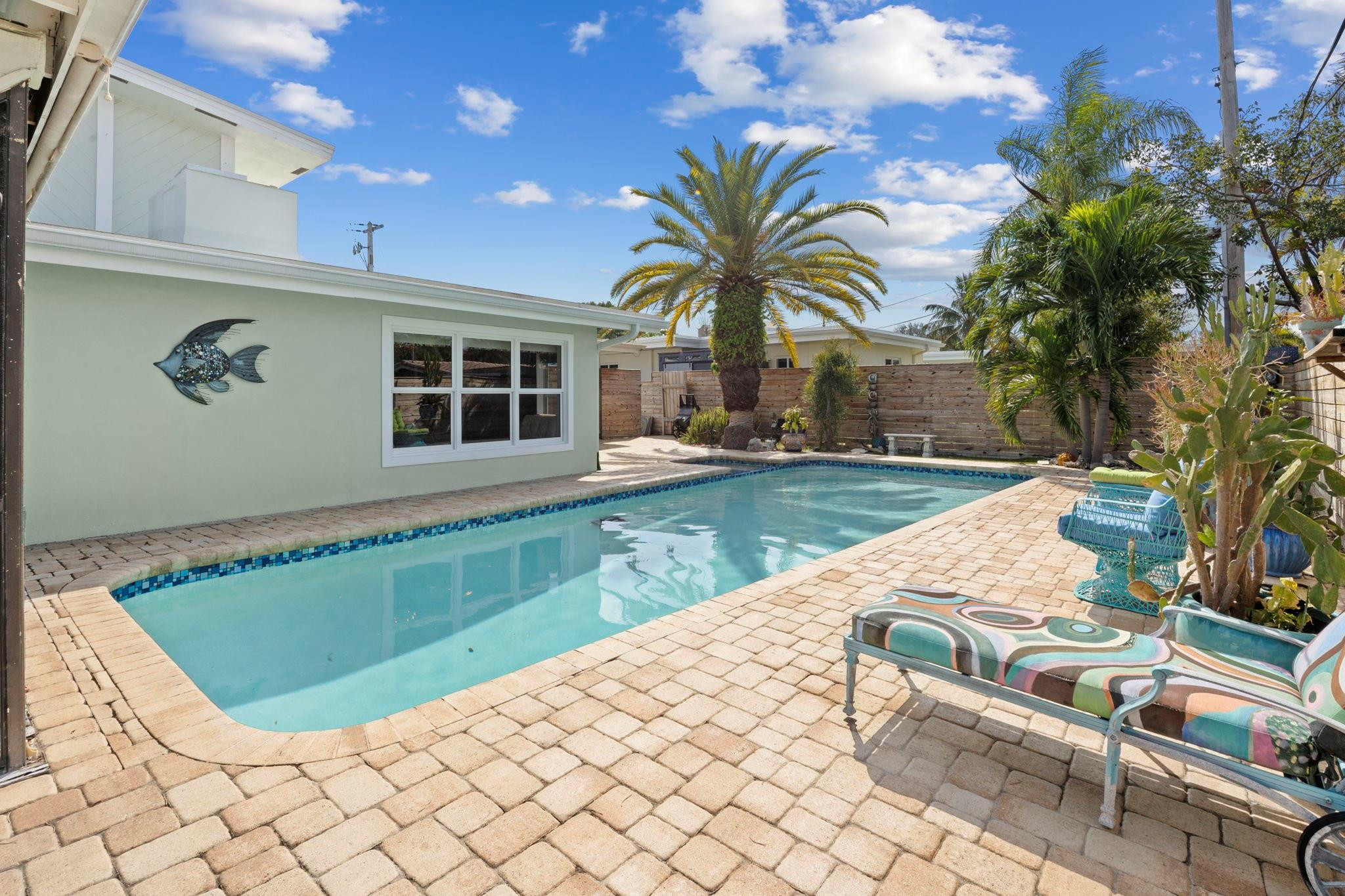 2675 Northeast 24th Street Lighthouse Point, FL 33064 - Photo 30 of 48 a view of swimming pool with chairs