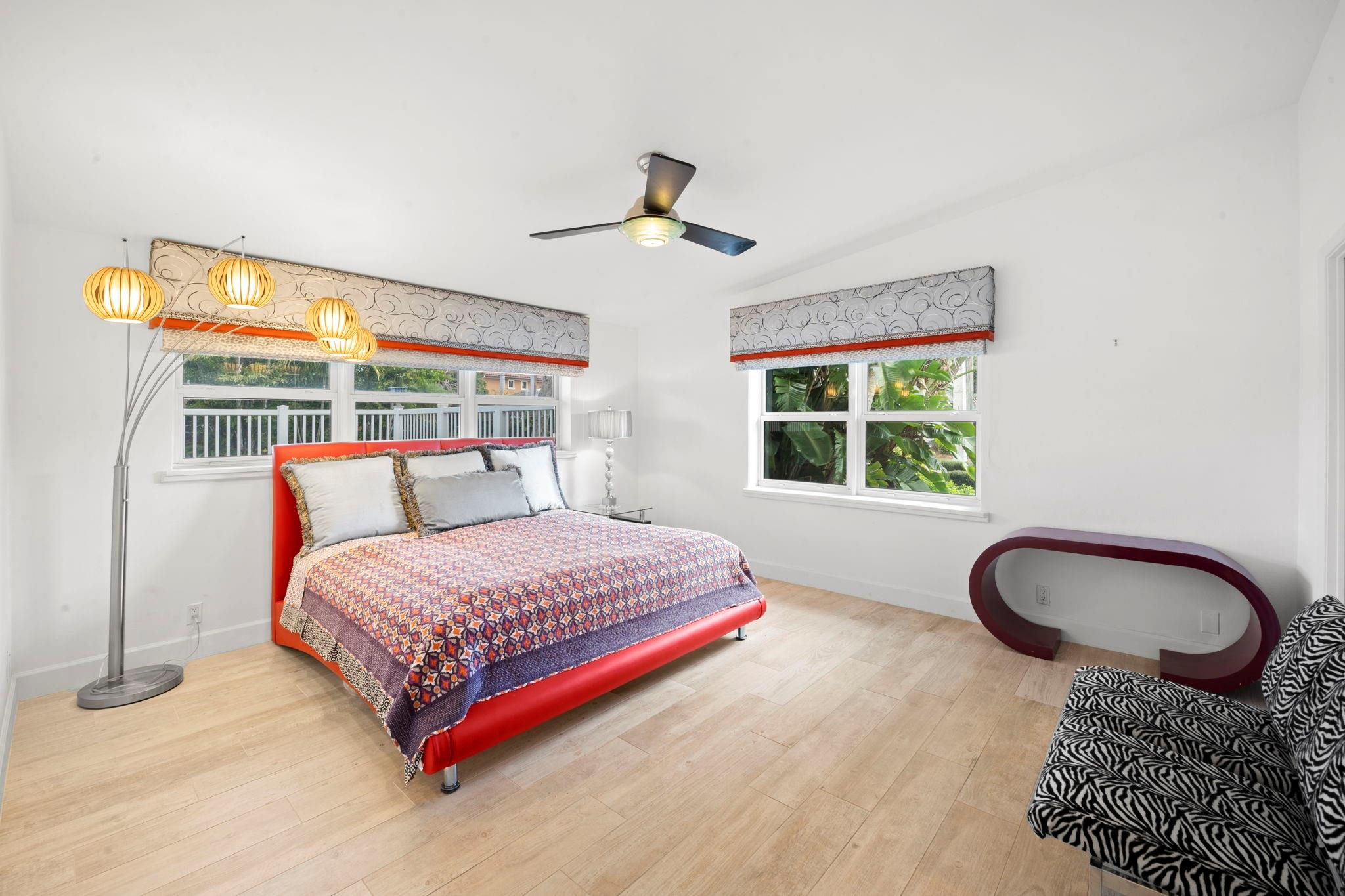 2675 Northeast 24th Street Lighthouse Point, FL 33064 - Photo 35 of 48 a bedroom with a bed and a window