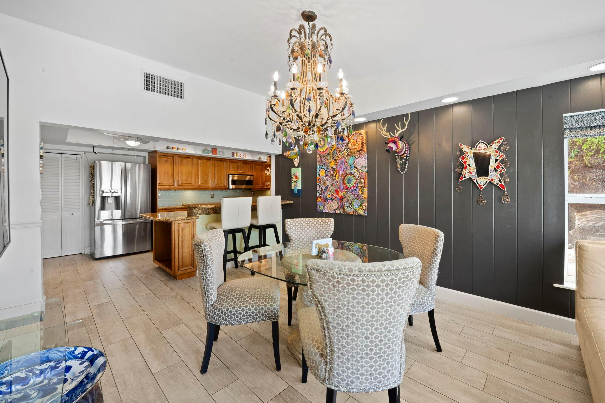 2675 Northeast 24th Street Lighthouse Point, FL 33064 - Photo 42 of 48 a view of a dining room with furniture and chandelier