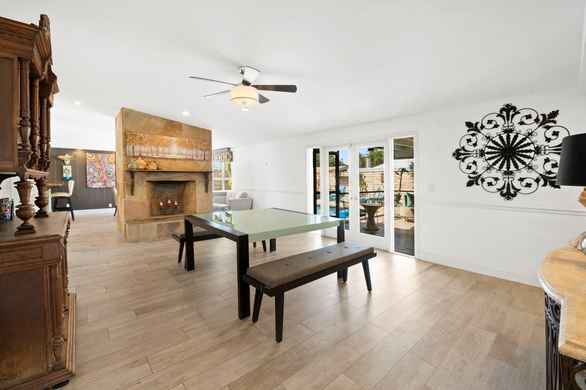 2675 Northeast 24th Street Lighthouse Point, FL 33064 - Photo 43 of 48 a living room with furniture a fireplace and a flat screen tv