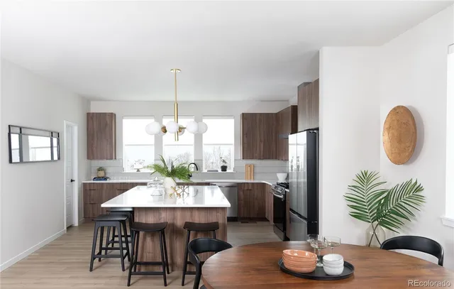 a view of a dining room with furniture window and wooden floor