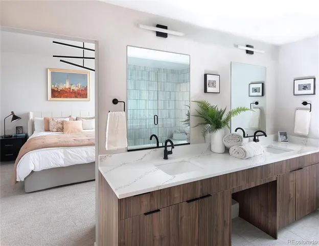 a en suite bathroom with double sink and a mirror