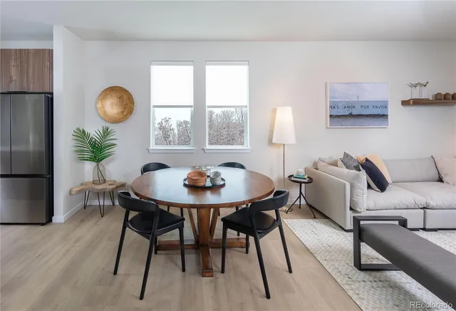 a view of a dining room with furniture and window