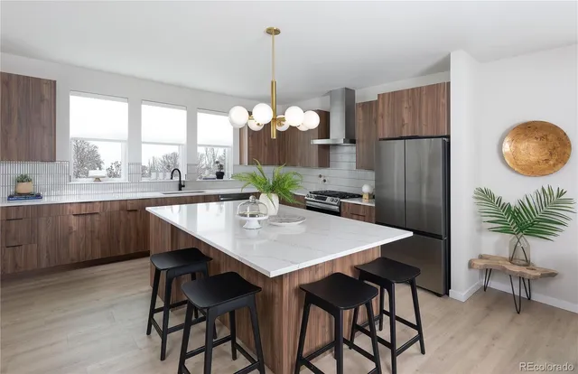 a very nice looking dining room with a table and chairs