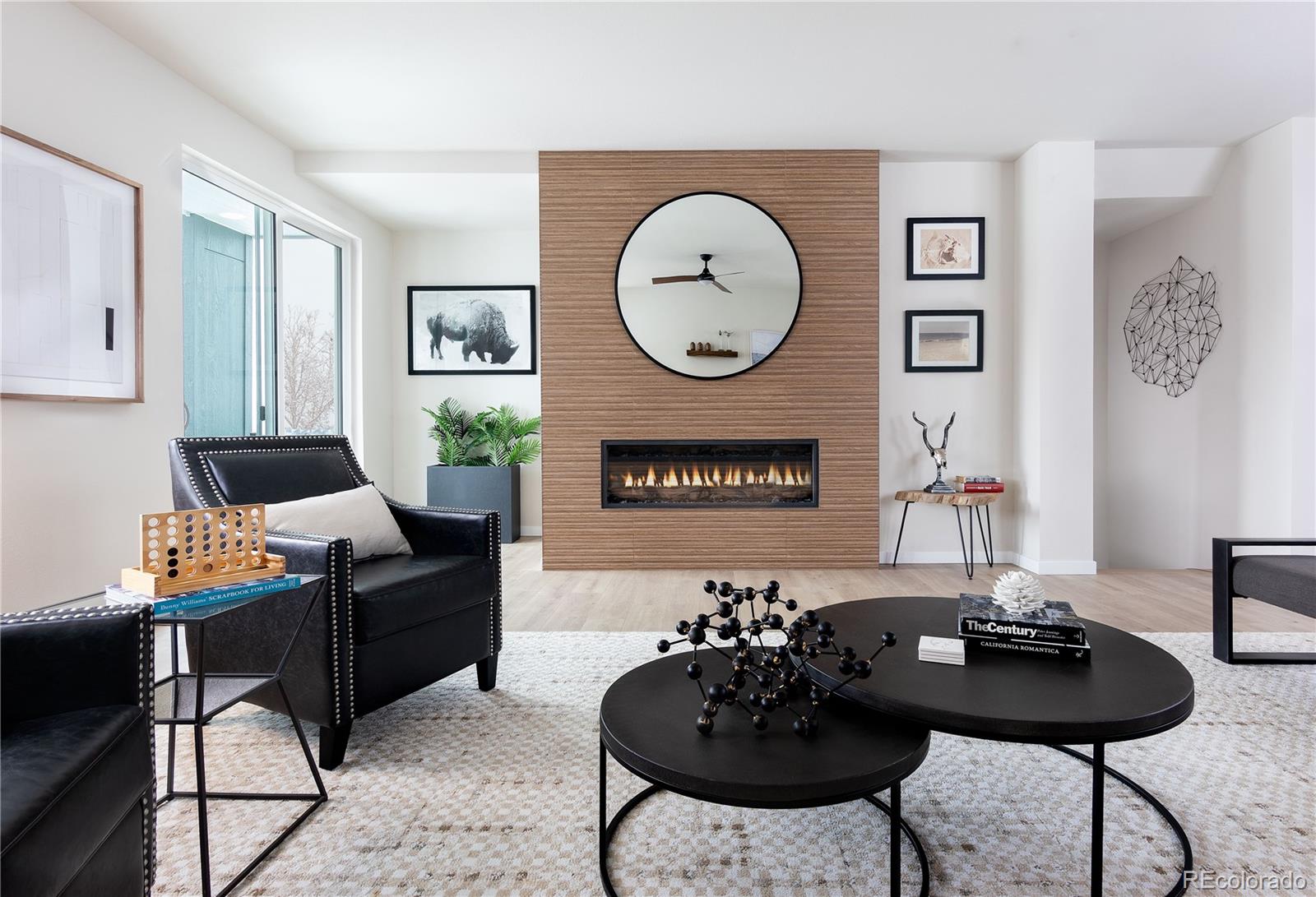 14472 Tranquil Court Morrison, CO 80465 - Photo 8 of 13 a living room with furniture a table and chair