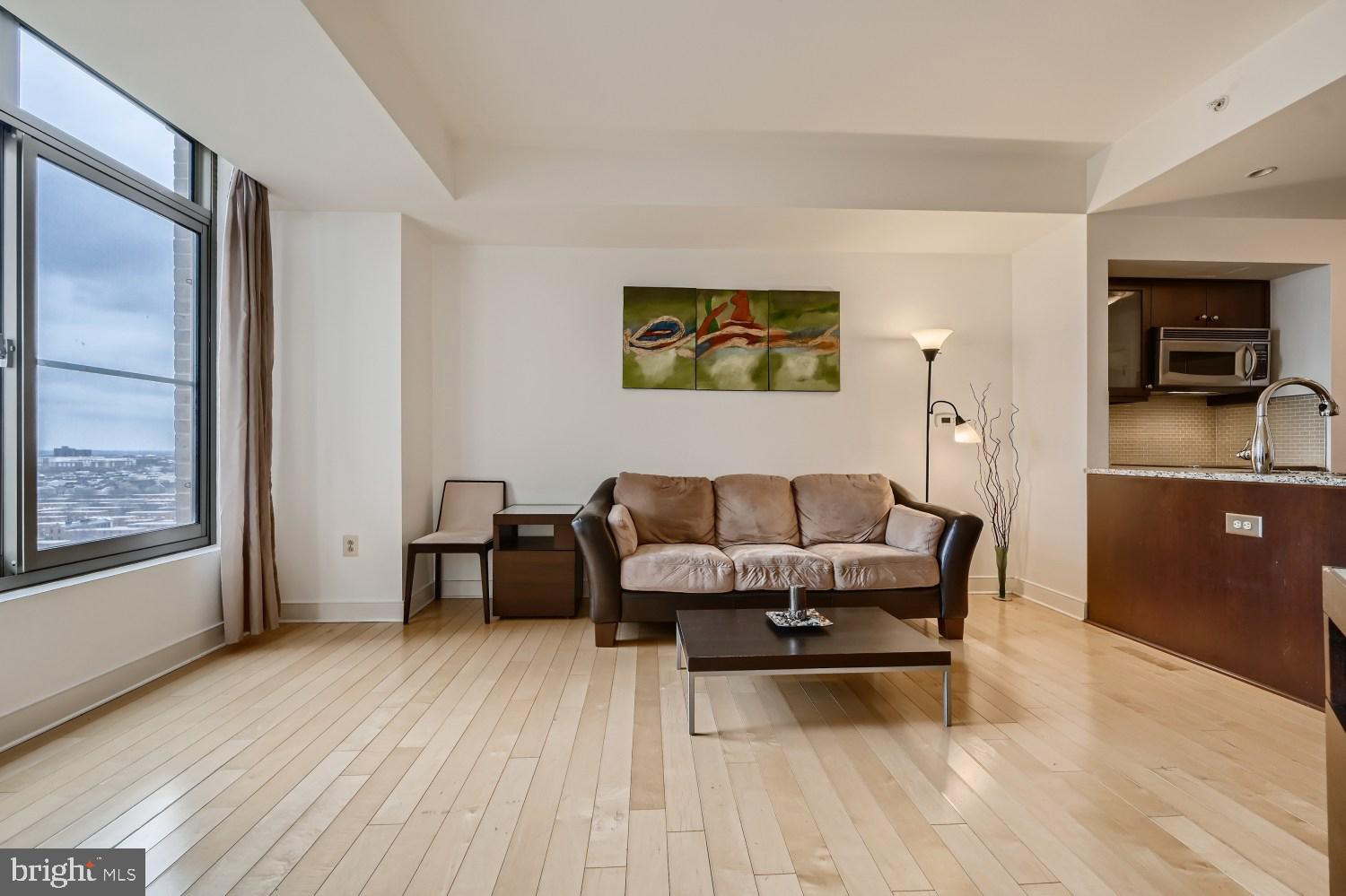 675 President Street, Unit 2107 Baltimore, MD 21202 - Photo 9 of 39 a dining room with furniture and wooden floor