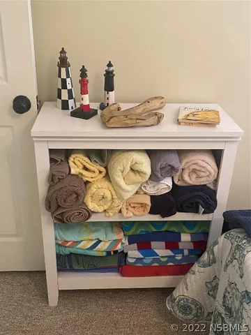 a bedroom with a bed and storage