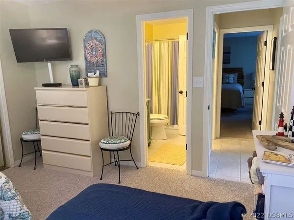 a view of living room and workspace