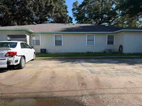 a car parked in front of a house