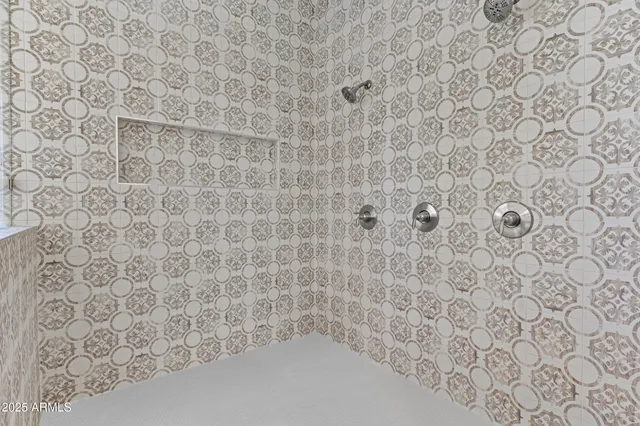 a bathroom with a sink vanity and mirror