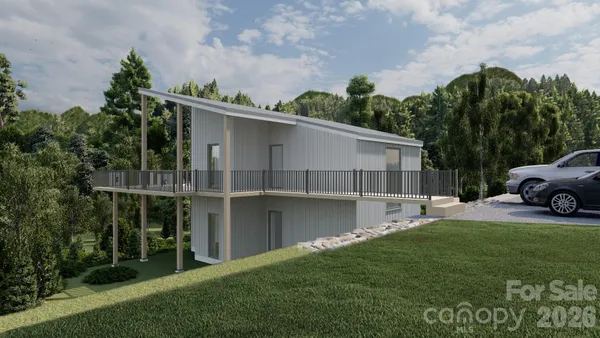 a view of a house with backyard and a garden