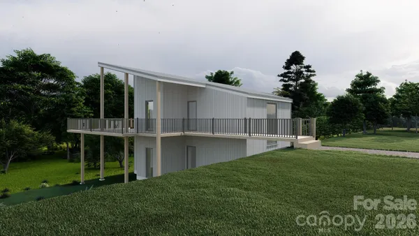 a house with lots of trees in the background