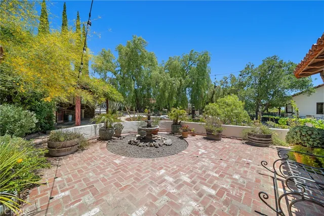 a view of a backyard with sitting area