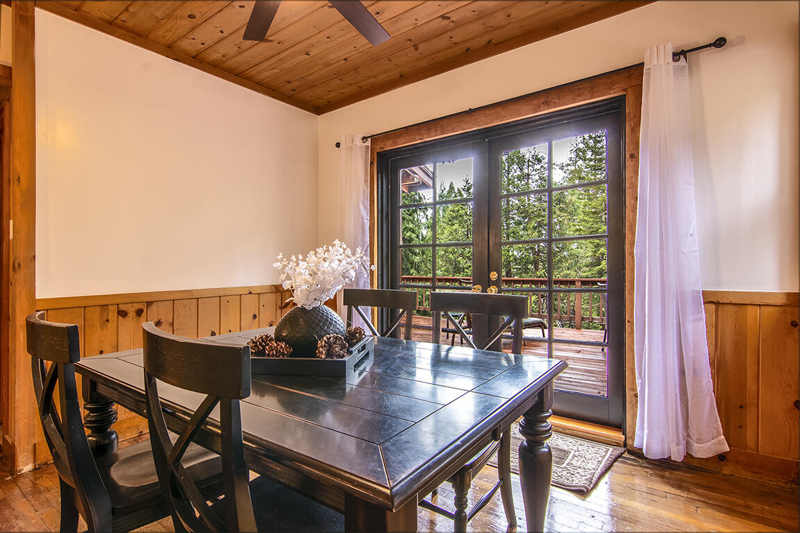 25455 Lodge Road Idyllwild, CA 92549 - Photo 19 of 95 a dining room with furniture and wooden floor