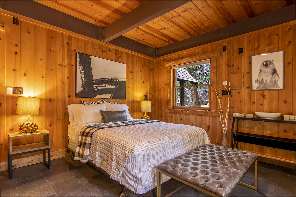 25455 Lodge Road Idyllwild, CA 92549 - Photo 26 of 95 a bedroom with a bed and wooden floor