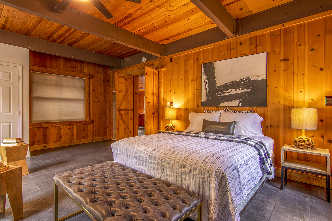 25455 Lodge Road Idyllwild, CA 92549 - Photo 28 of 95 a bedroom with a bed and wooden floor
