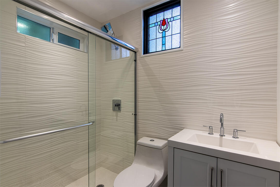 25455 Lodge Road Idyllwild, CA 92549 - Photo 30 of 95 a bathroom with a toilet sink and shower