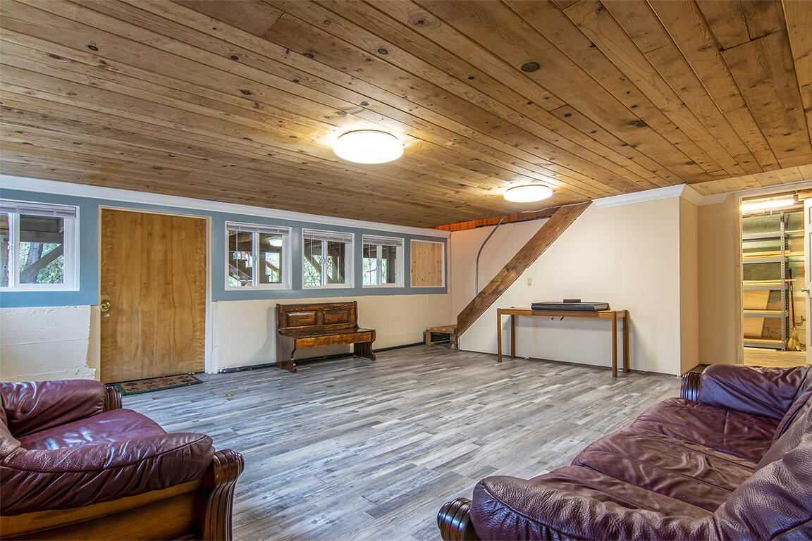 25455 Lodge Road Idyllwild, CA 92549 - Photo 39 of 95 a living room with furniture and a wooden floor