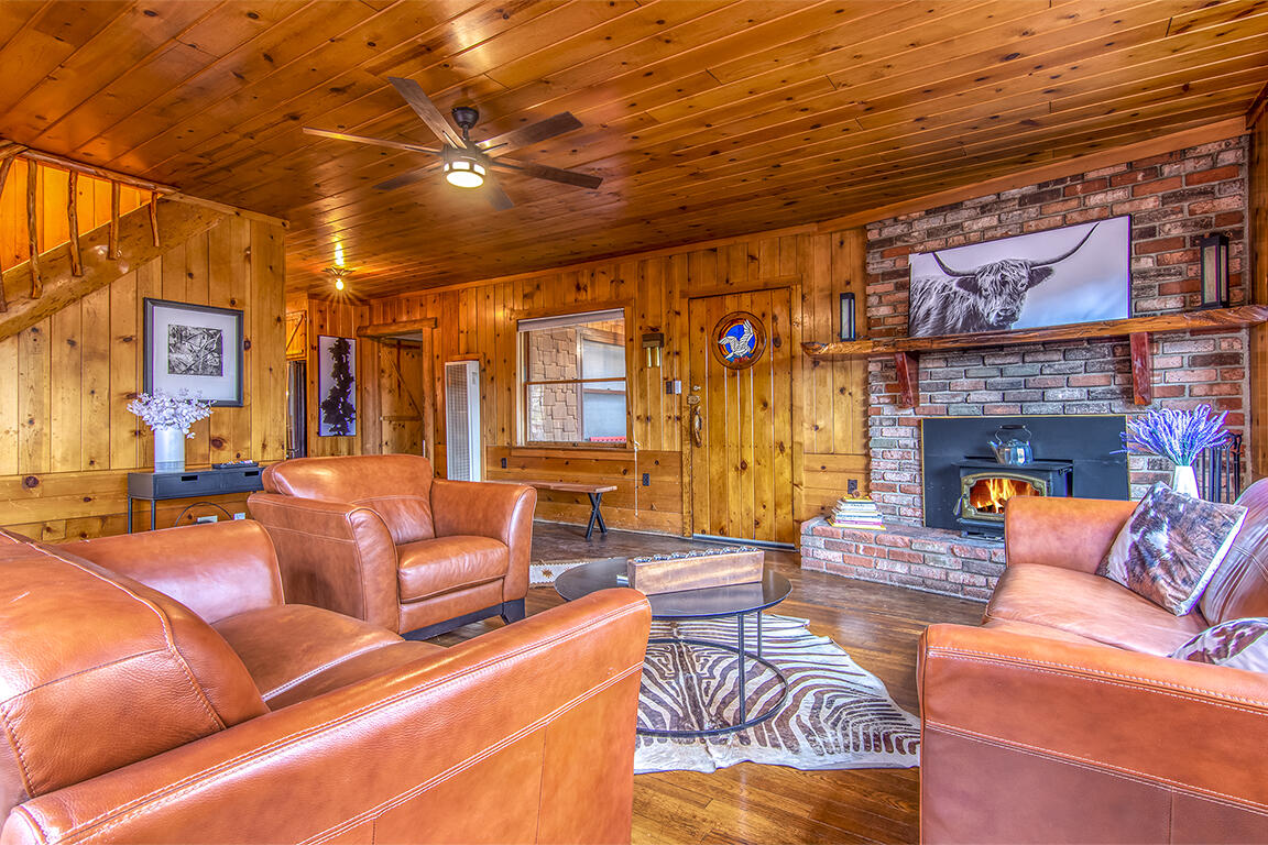 25455 Lodge Road Idyllwild, CA 92549 - Photo 7 of 95 a outdoor living space with patio furniture and a fireplace