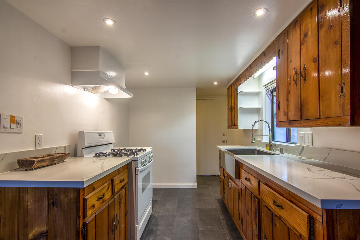 25455 Lodge Road Idyllwild, CA 92549 - Photo 63 of 95 a kitchen that has a sink and a stove