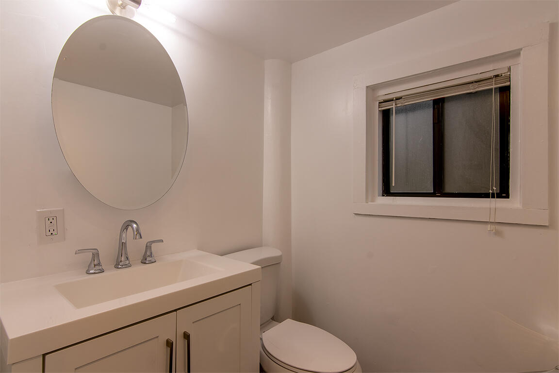 25455 Lodge Road Idyllwild, CA 92549 - Photo 70 of 95 a bathroom with a toilet sink and mirror