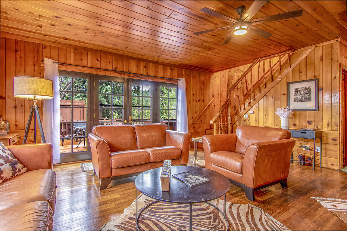 25455 Lodge Road Idyllwild, CA 92549 - Photo 9 of 95 a living room with furniture a wooden floor and next to a window