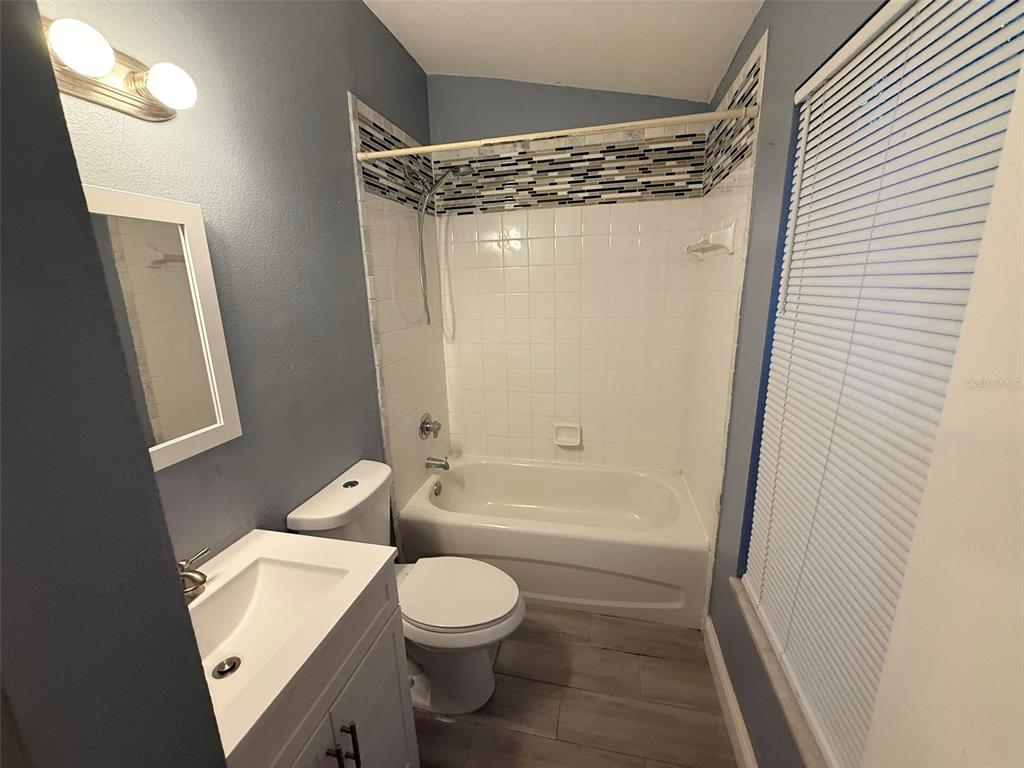 1325 Lyonshire Drive Wesley Chapel, FL 33543 - Photo 13 of 20 a bathroom with a sink a toilet and shower