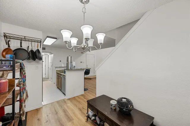 a view of a kitchen with a sink stainless steel appliances and cabinets