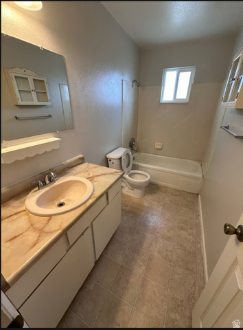 102 East Richelman Lane Wellington, UT 84542 - Photo 12 of 14 Vanity with a decorative countertop and integrated sink