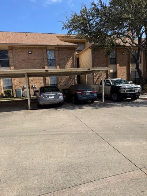 16301 Ledgemont Lane, Unit 257 Addison, TX 75001 - Photo 20 of 21 One assigned covered parking space with the unit