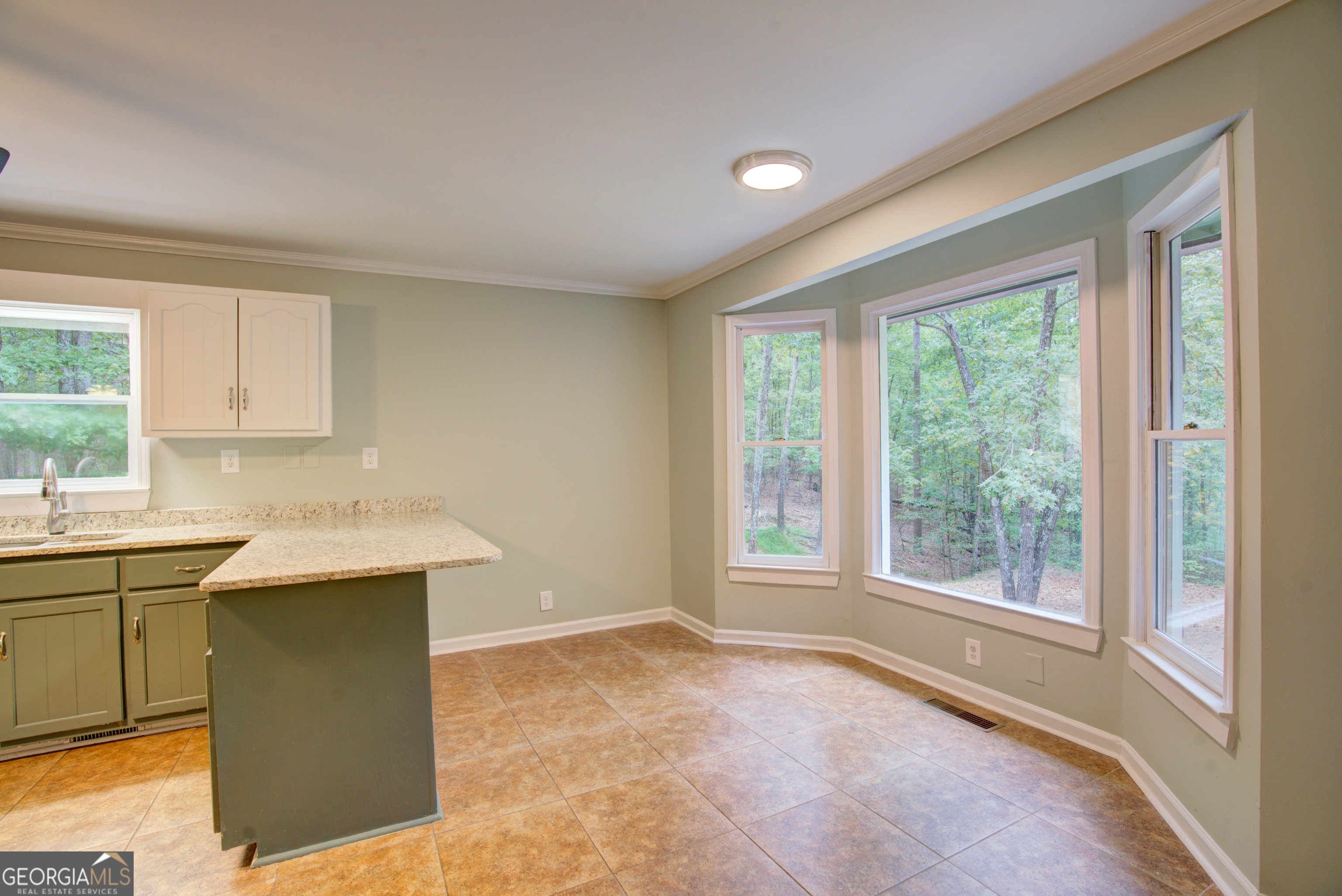 637 Wayside Road Rome, GA 30161 - Photo 11 of 40 a kitchen with a sink and a window