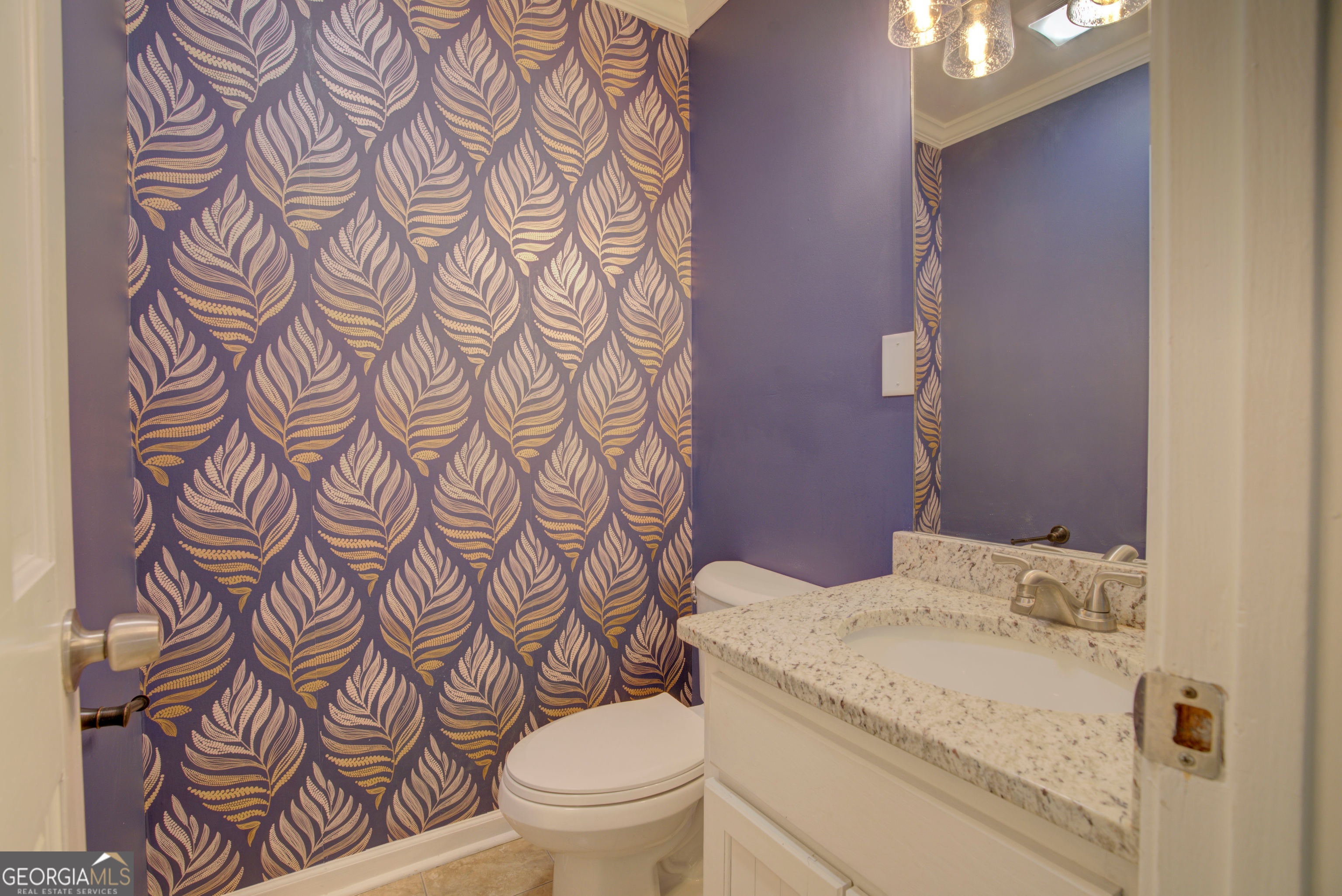 637 Wayside Road Rome, GA 30161 - Photo 12 of 40 a bathroom with a granite countertop toilet and a sink