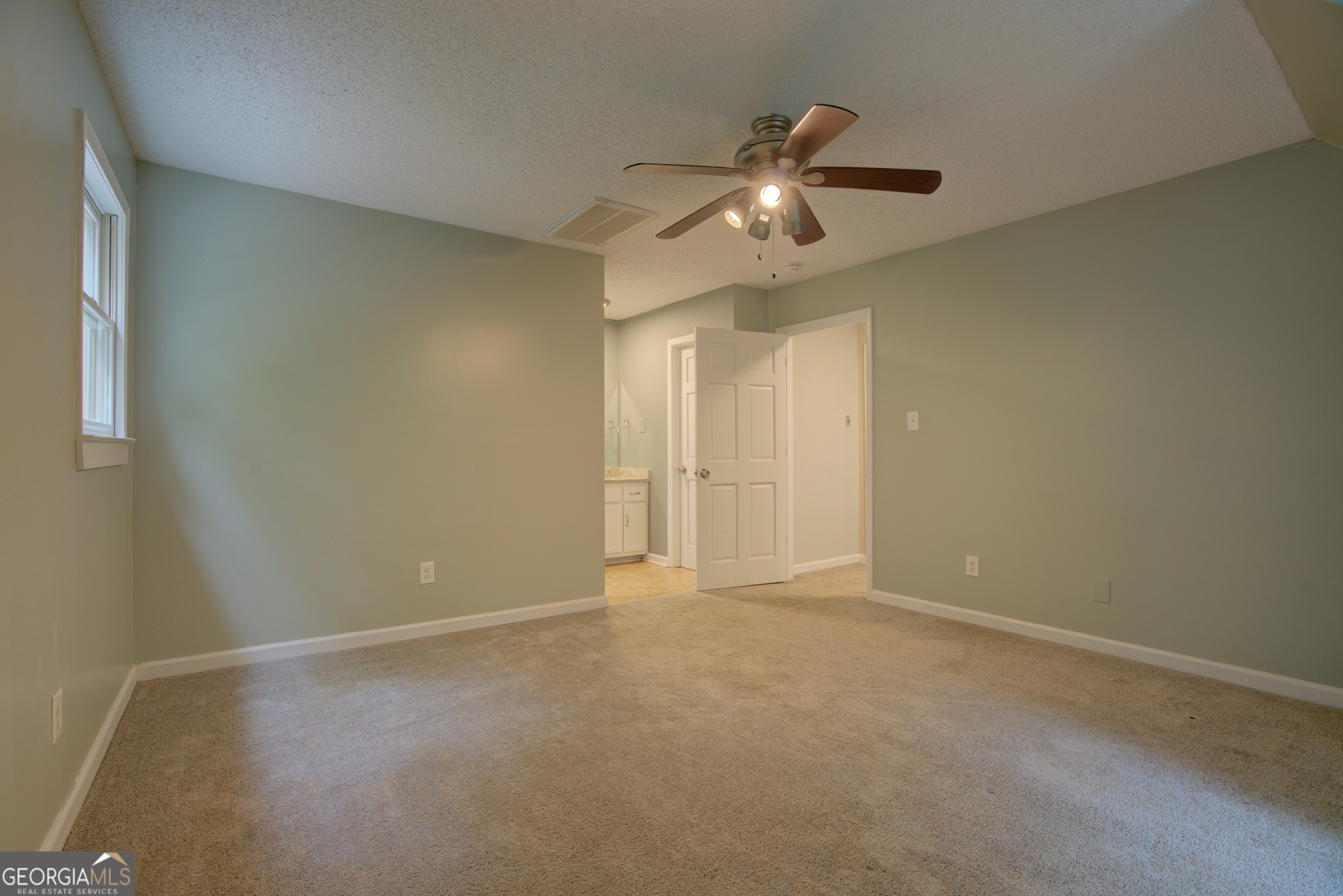 637 Wayside Road Rome, GA 30161 - Photo 27 of 40 a view of an empty room with a chandelier fan