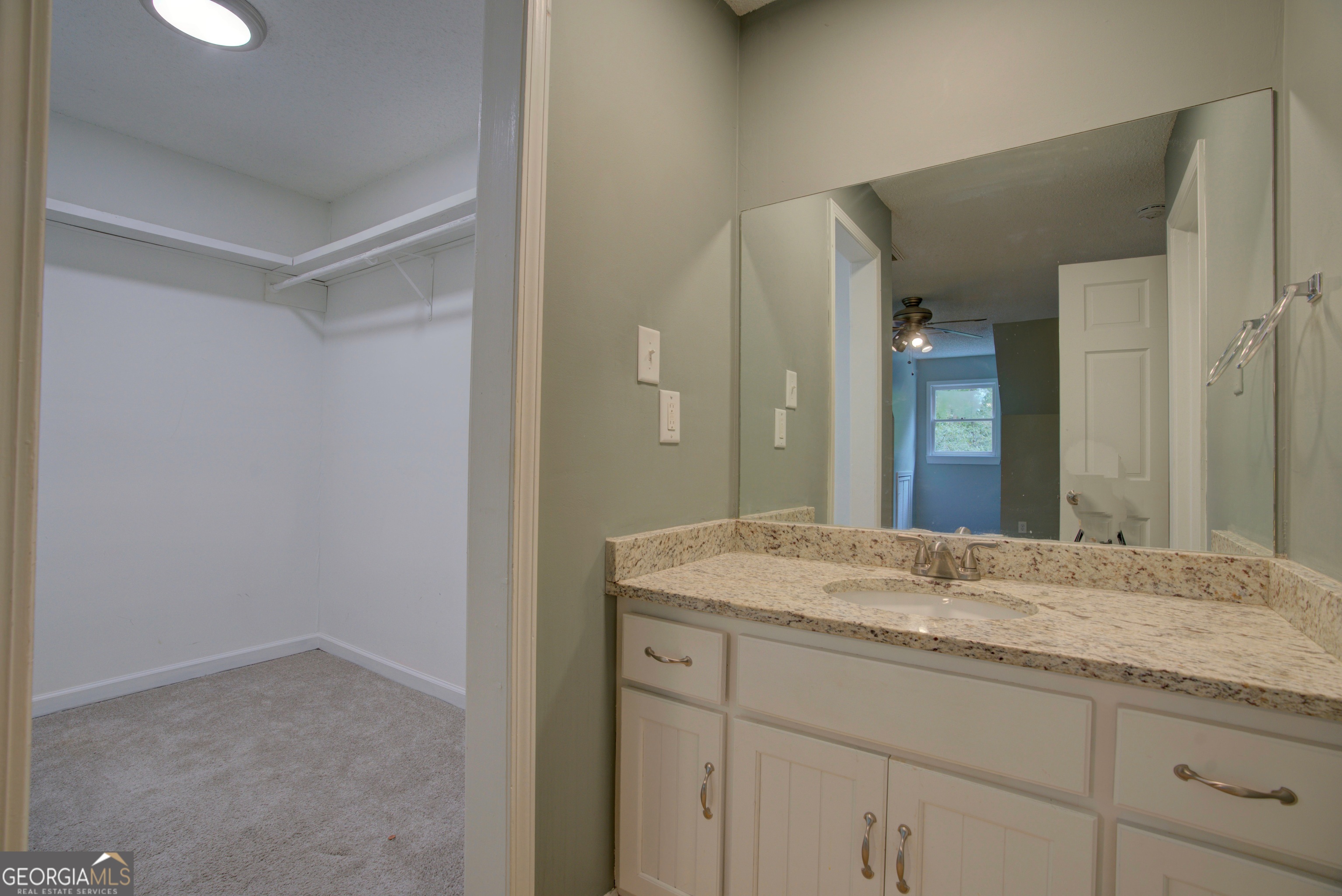 637 Wayside Road Rome, GA 30161 - Photo 28 of 40 a bathroom with a granite countertop sink and a mirror