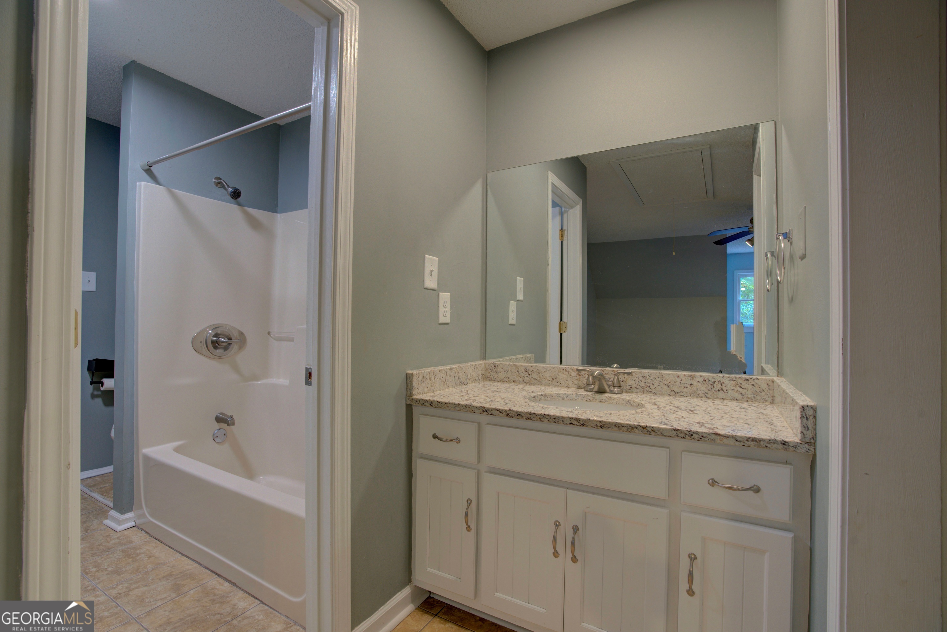 637 Wayside Road Rome, GA 30161 - Photo 30 of 40 a bathroom with a granite countertop sink tub and mirror