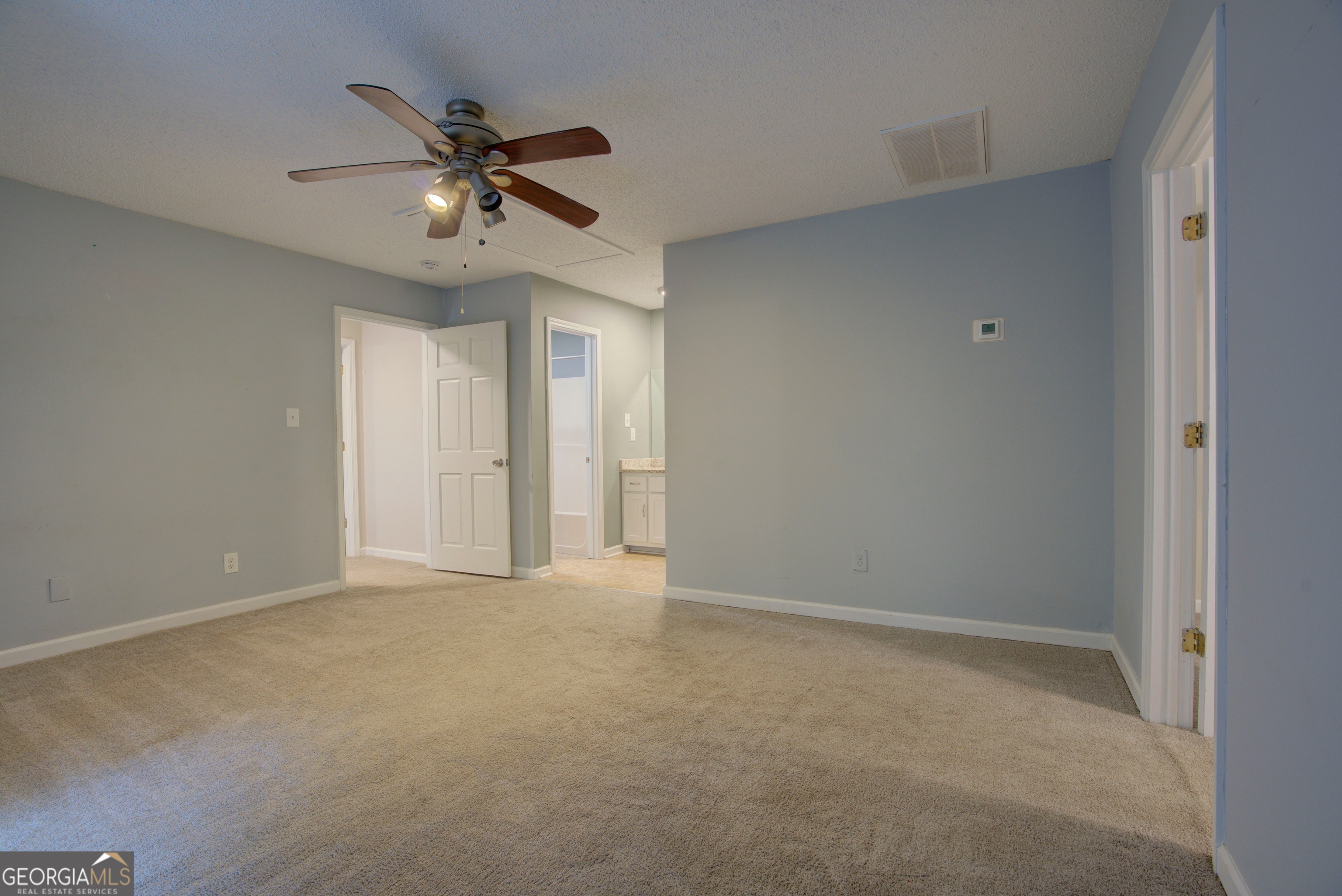 637 Wayside Road Rome, GA 30161 - Photo 32 of 40 a view of an empty room with a ceiling fan