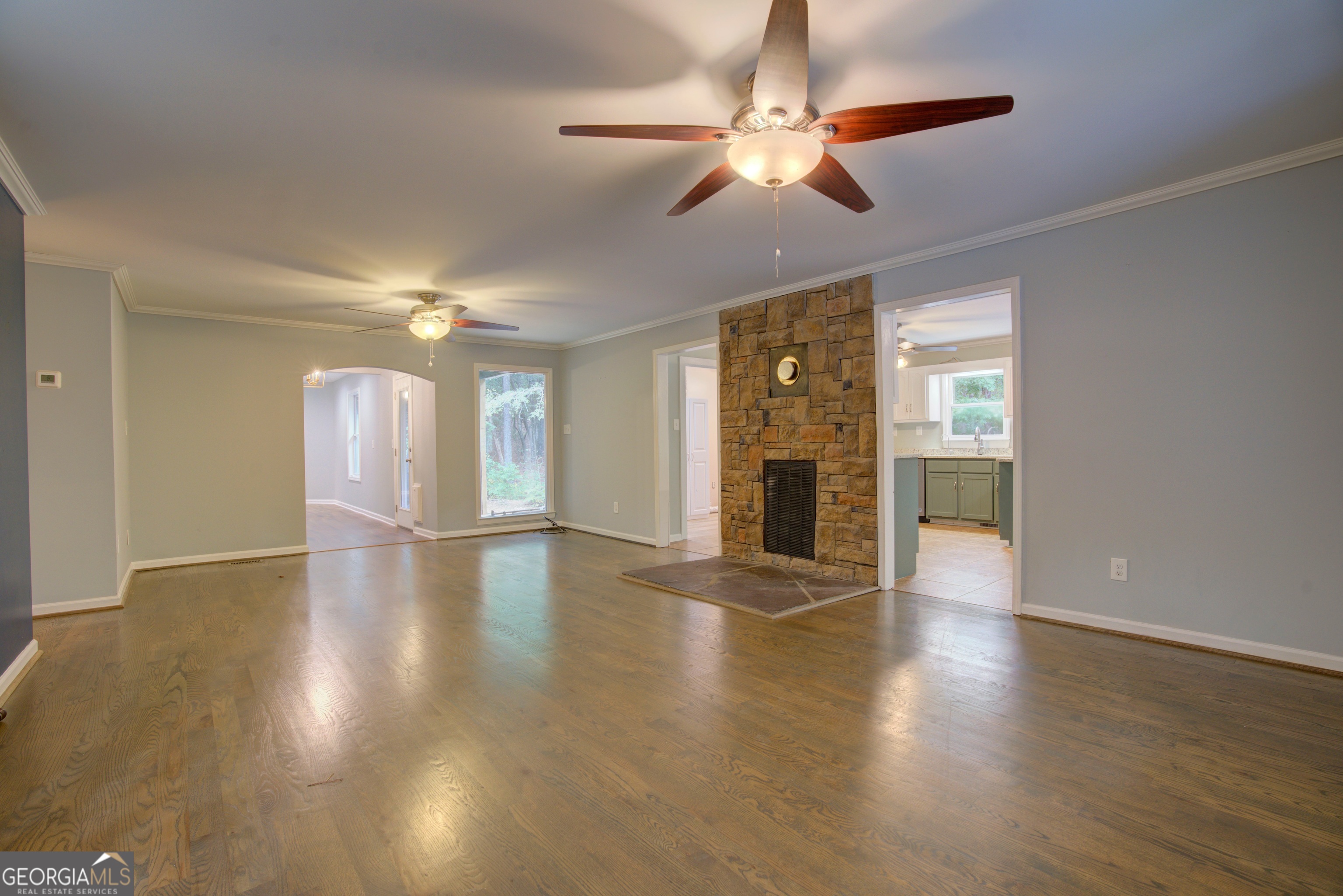 637 Wayside Road Rome, GA 30161 - Photo 5 of 40 a view of an empty room with wooden floor and a window