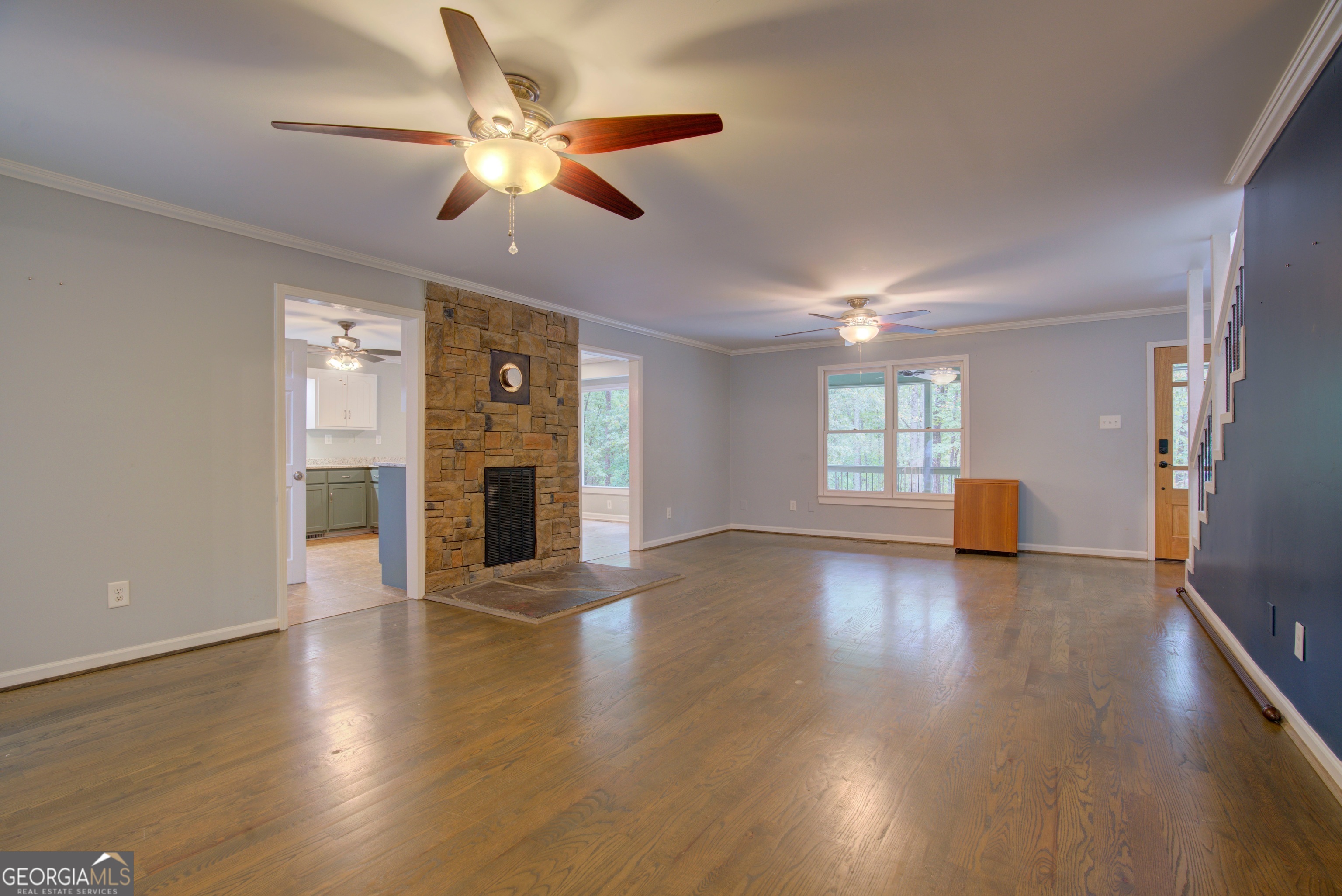 637 Wayside Road Rome, GA 30161 - Photo 7 of 40 a view of an empty room with window and wooden floor