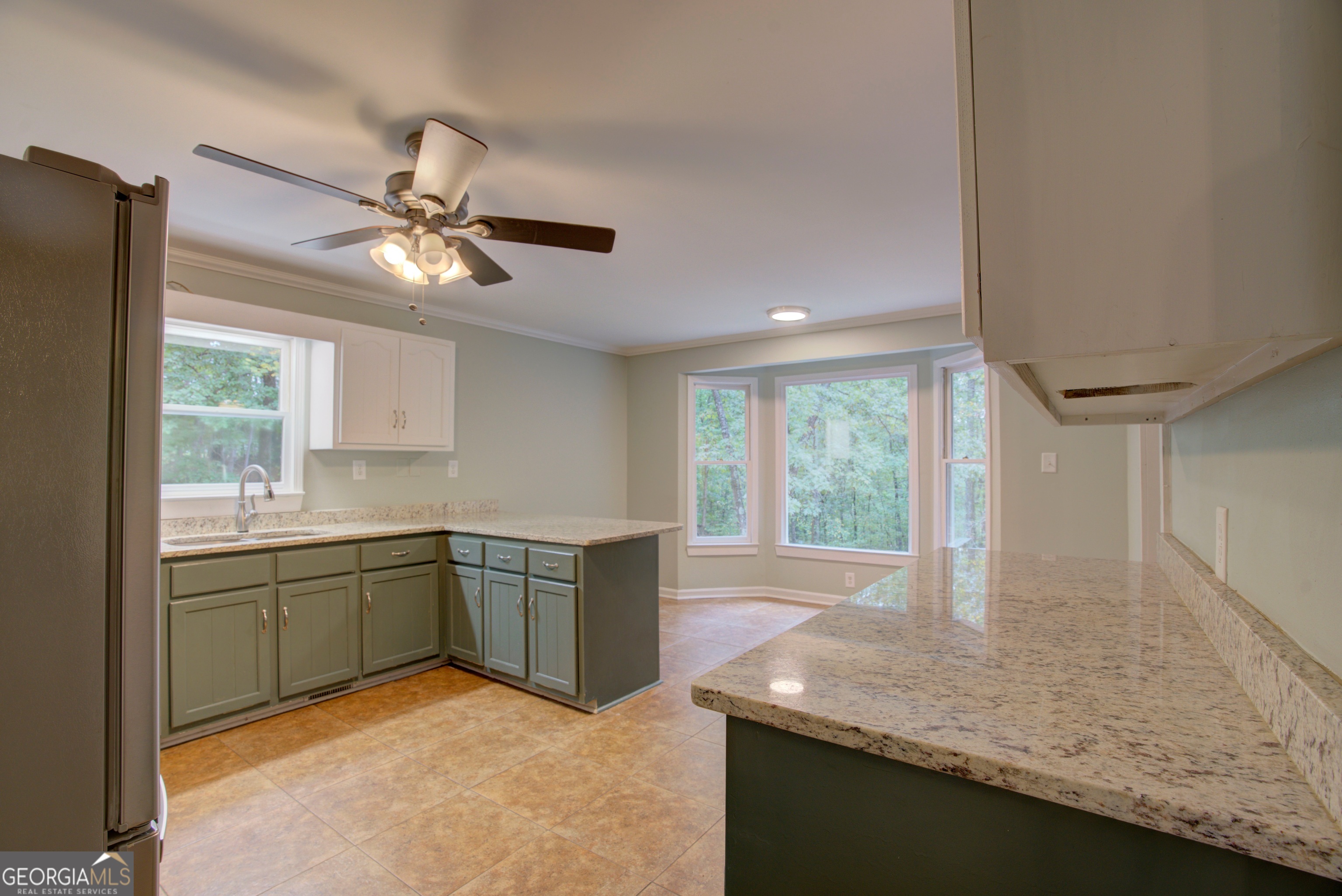 637 Wayside Road Rome, GA 30161 - Photo 9 of 40 a kitchen with stainless steel appliances granite countertop a sink a window and a counter top space