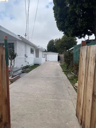 a view of a backyard of the house